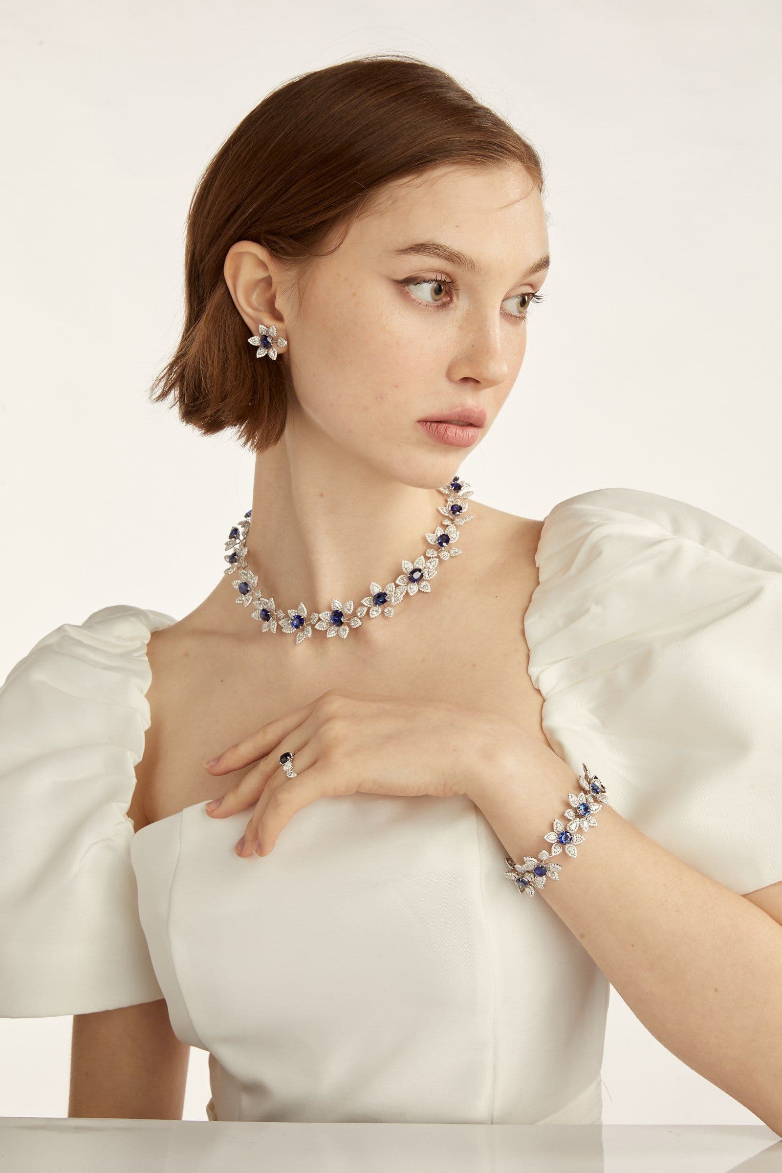 A signature royal blue sapphire suite from the CLEAR atelier — composed and shot for editorial.